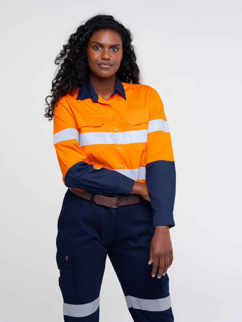 Ladies hi‑vis 190 gsm cotton drill shirt in orange/navy featuring reflective tape, extended sun‑protection collar, tapered fit and nine‑button front for day & night use