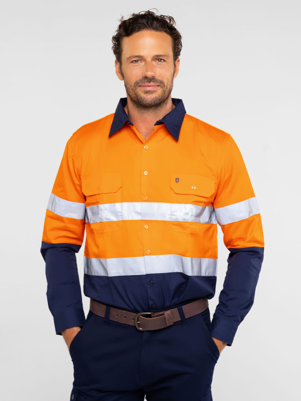 Men’s hi‑vis lightweight 150 gsm ripstop cotton shirt in orange/navy with 50 mm reflective tape, vented underarms/back, extended sun‑protection collar and modern fit
