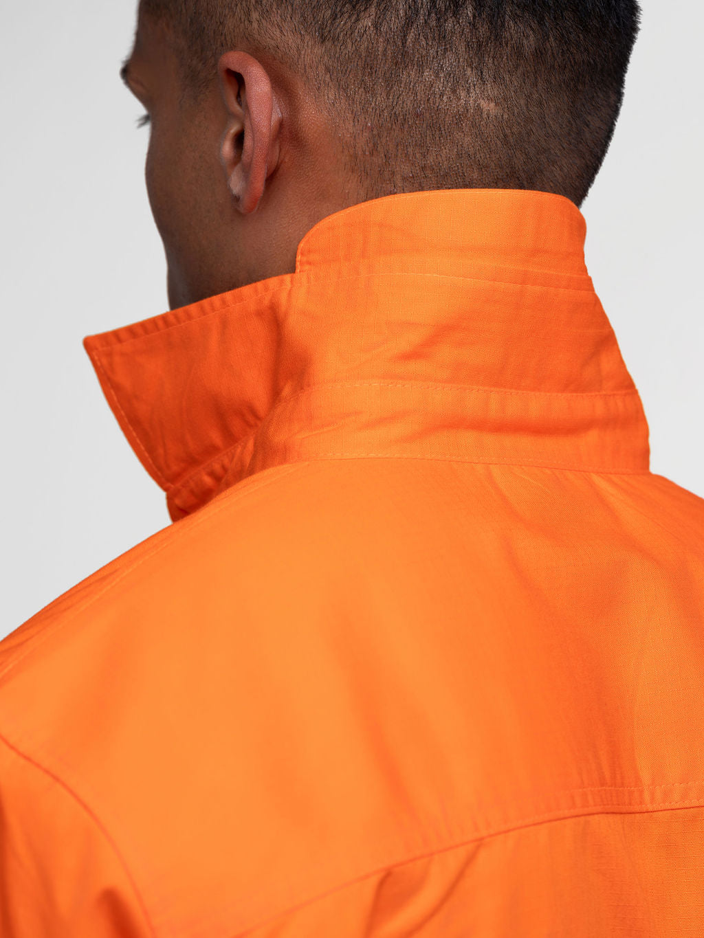 Men’s hi‑vis lightweight ripstop cotton shirt in orange with reflective tape, vented underarms/back, extended sun‑protection collar and modern tapered fit