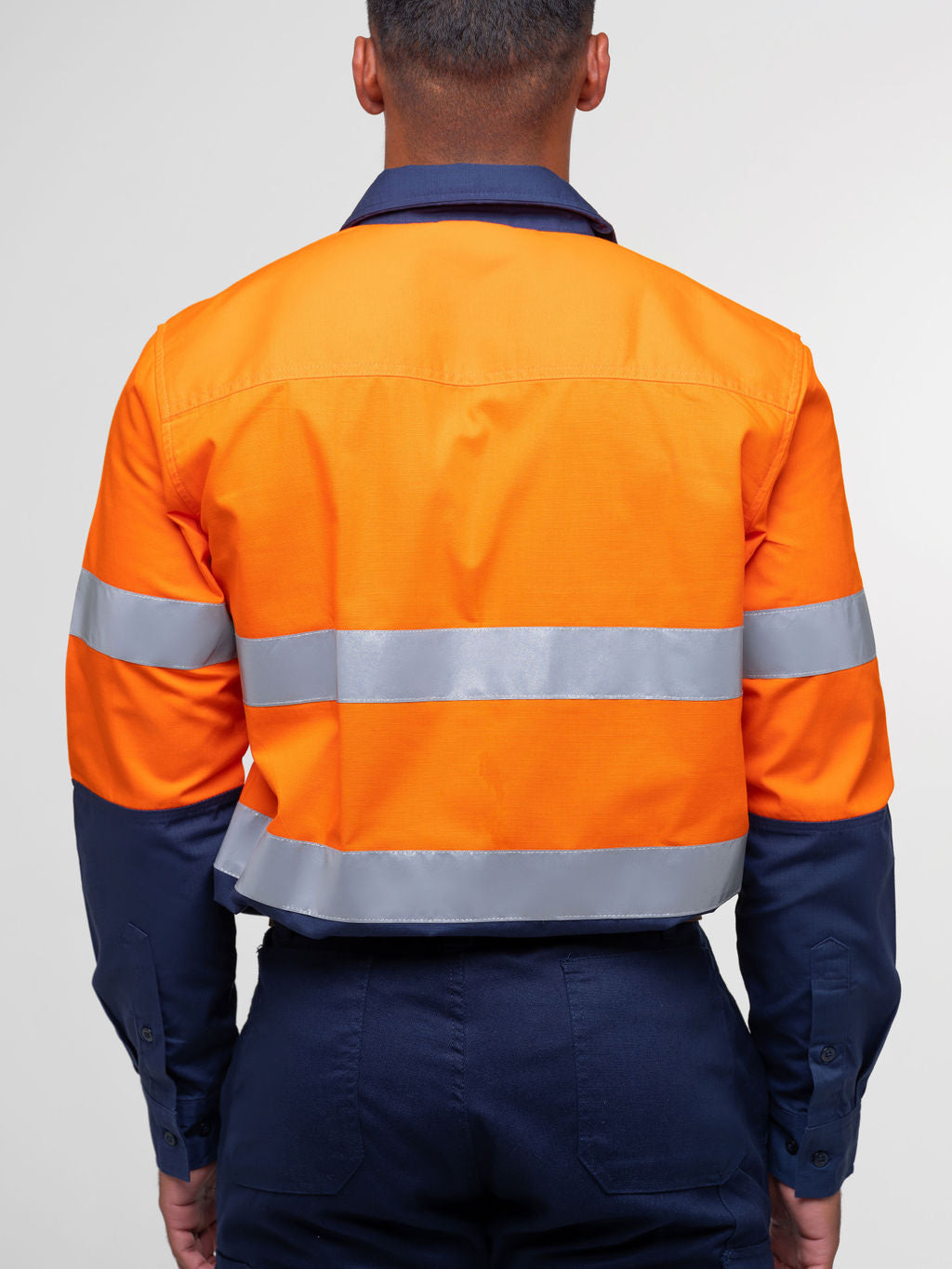 Men’s hi‑vis regular‑weight 190 gsm cotton drill long‑sleeve shirt in orange/navy with reflective tape, extended sun‑protection collar and modern tapered fit for day/night use