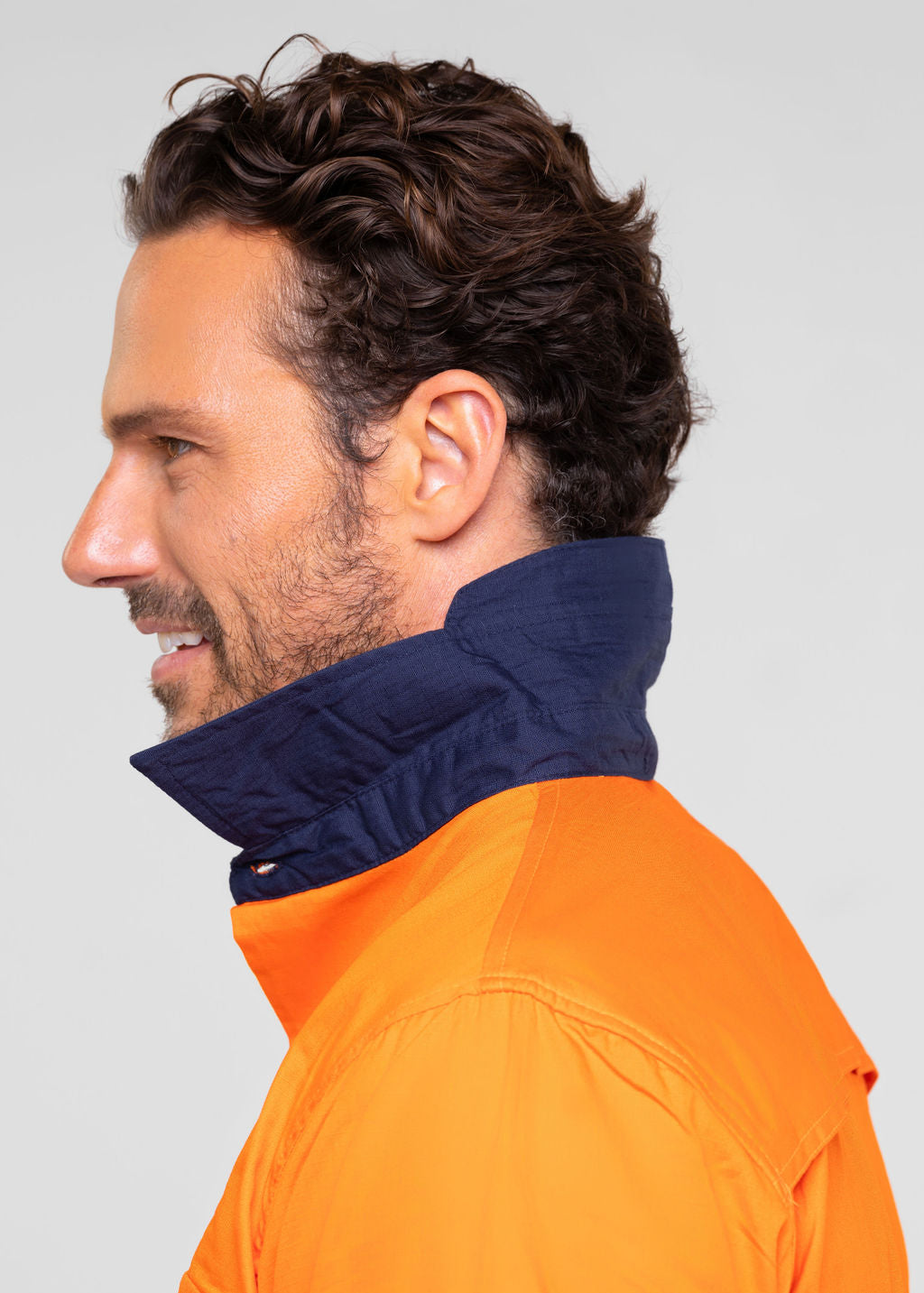Men’s hi‑vis regular‑weight 190 gsm cotton drill long‑sleeve shirt in orange/navy with reflective tape, extended sun‑protection collar and modern tapered fit for day/night use